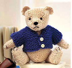 teddy with blue knitted coat